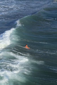 People swimming in sea