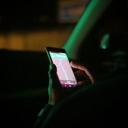 Woman photographing through smart phone