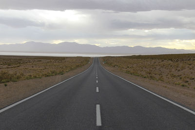 Empty road against sky