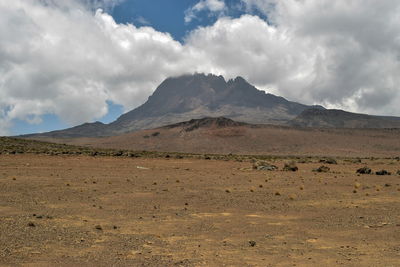 Scenic mountain against a cloudy sky, mawenzi peak, mount kilimanjaro