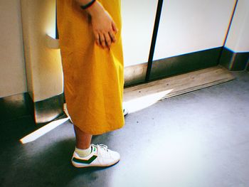 Low section of woman standing on floor