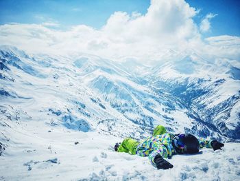 Scenic view of snow covered mountains against sky