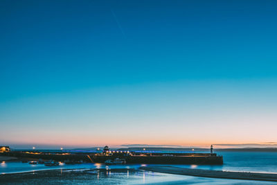 Scenic view of sea against clear blue sky