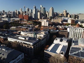 High angle view of modern buildings in city against sky