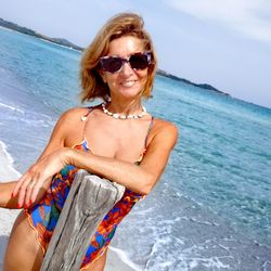 Portrait of smiling woman at beach