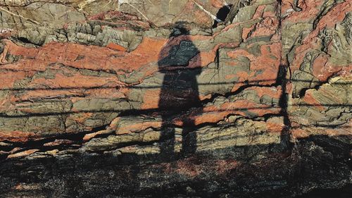 Shadow of woman on rock