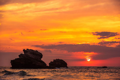 Scenic view of sea against romantic sky at sunset