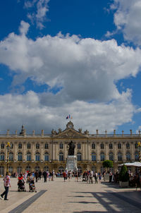 Tourists in front of building