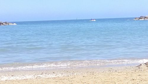 Scenic view of sea against clear sky