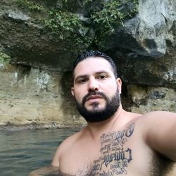 Portrait of young man on rock