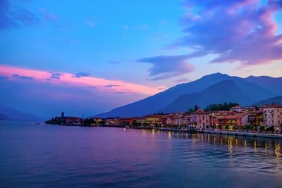 Scenic view of lake against sky at sunset