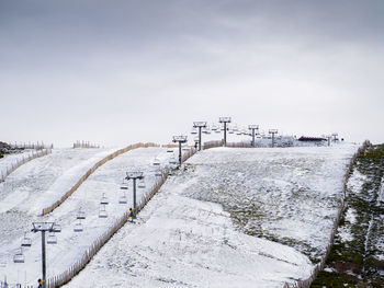 High angle view of snow covered road against sky