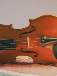 Close-up of violin against white background