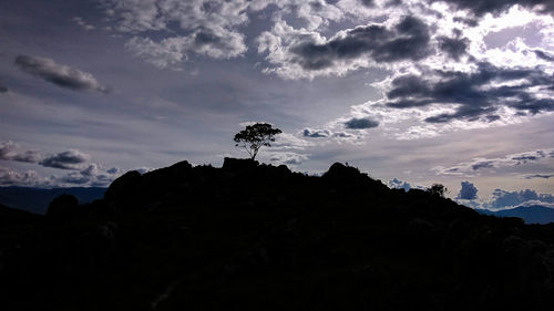 Low angle view of silhouette mountain against sky