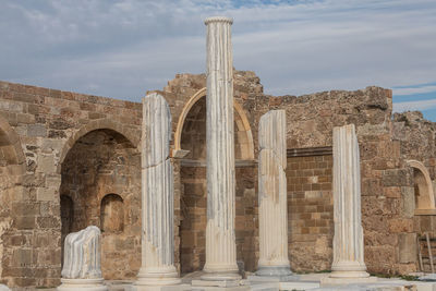 Low angle view of old ruins against sky