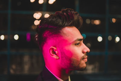 Portrait of young man looking away