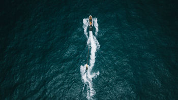 High angle view of boats sailing in sea