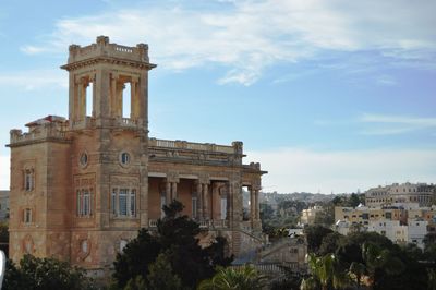 View of historical building against cloudy sky