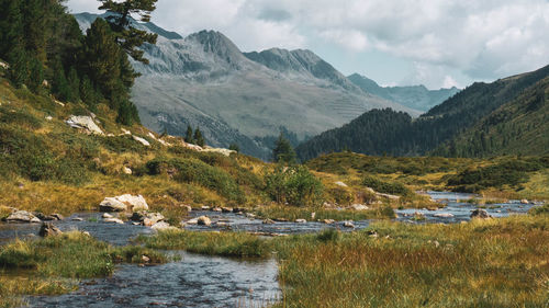 Scenic view of lake and mountains against sky