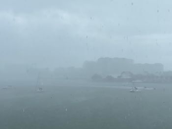 Scenic view of sea against sky during rainy season