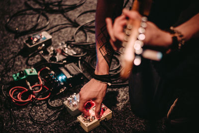 Low section of woman playing guitar