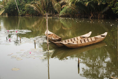 Boats moored in lake