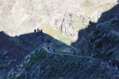 Tourists on rocky mountain