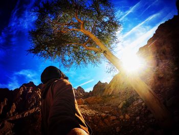 Rear view of man against sky