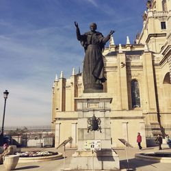 Low angle view of statue against cloudy sky