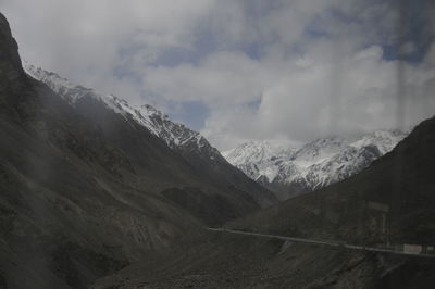 Scenic view of snow mountains against sky