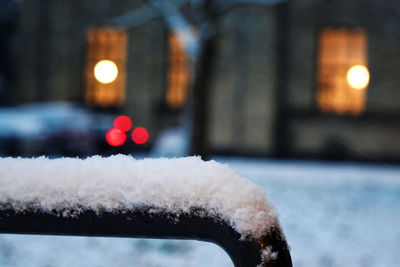 Close-up of snow on metal rod