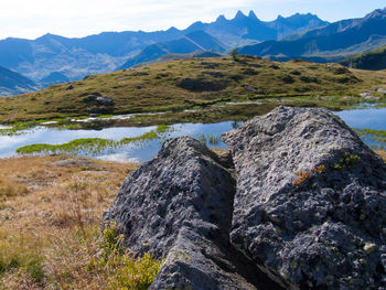 Scenic view of mountains against blue sky