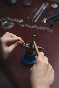 Close up jewelry hammer and tiny anvil concept photo