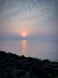 Scenic view of sea at sunset