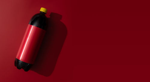 Close-up of electronic cigarette on yellow background