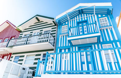 Low angle view of buildings against blue sky