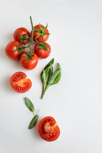 Close-up of cherry tomatoes against white background