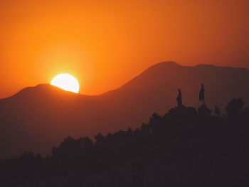 Scenic view of mountains at sunset