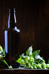 Close-up of drink on table against black background