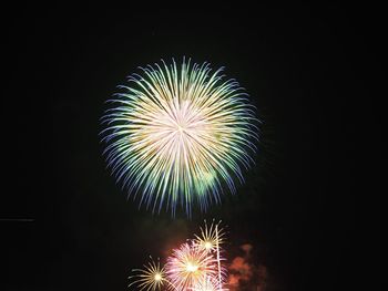 Firework display at night