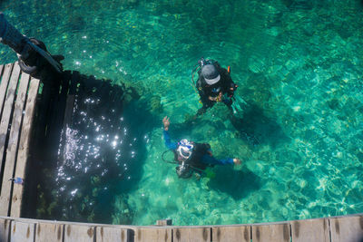 High angle view of scuba divers in sea