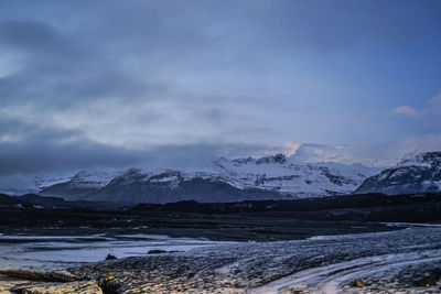 Scenic view of snowcapped mountains against sky