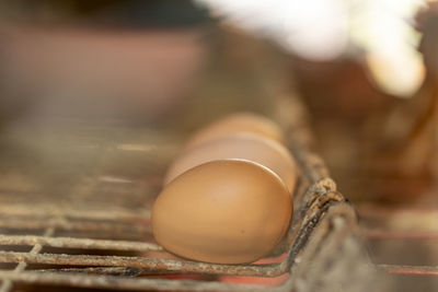 Close-up of broken egg on table