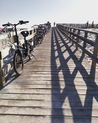 Shadow of railing on footpath