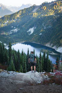 Rear view of man walking on mountain