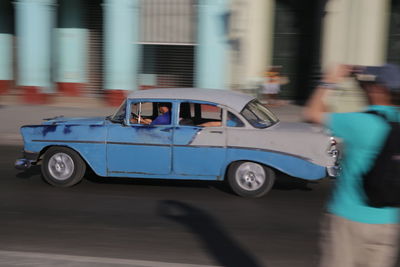 Side view of vintage car on road