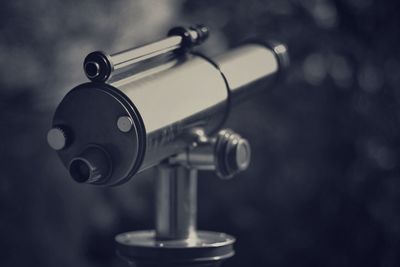 Close-up of coin operated binoculars against blurred background