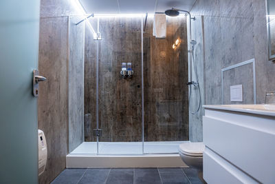 Interior of elegant illuminated modern bathroom in luxurious hotel