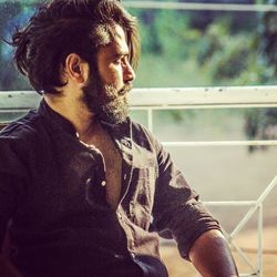 Young man looking away outdoors