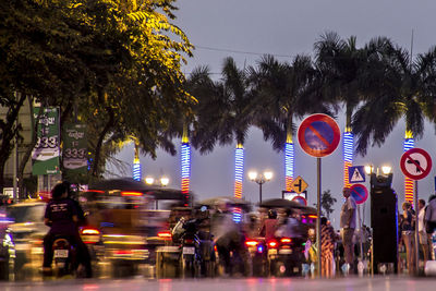 Cars on city street at night